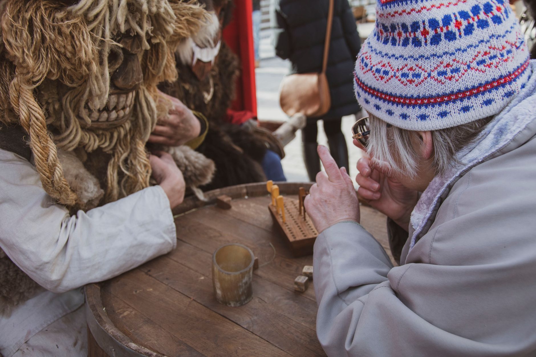 Adults engaged in a traditional game during Moscow's Maslenitsa festival.