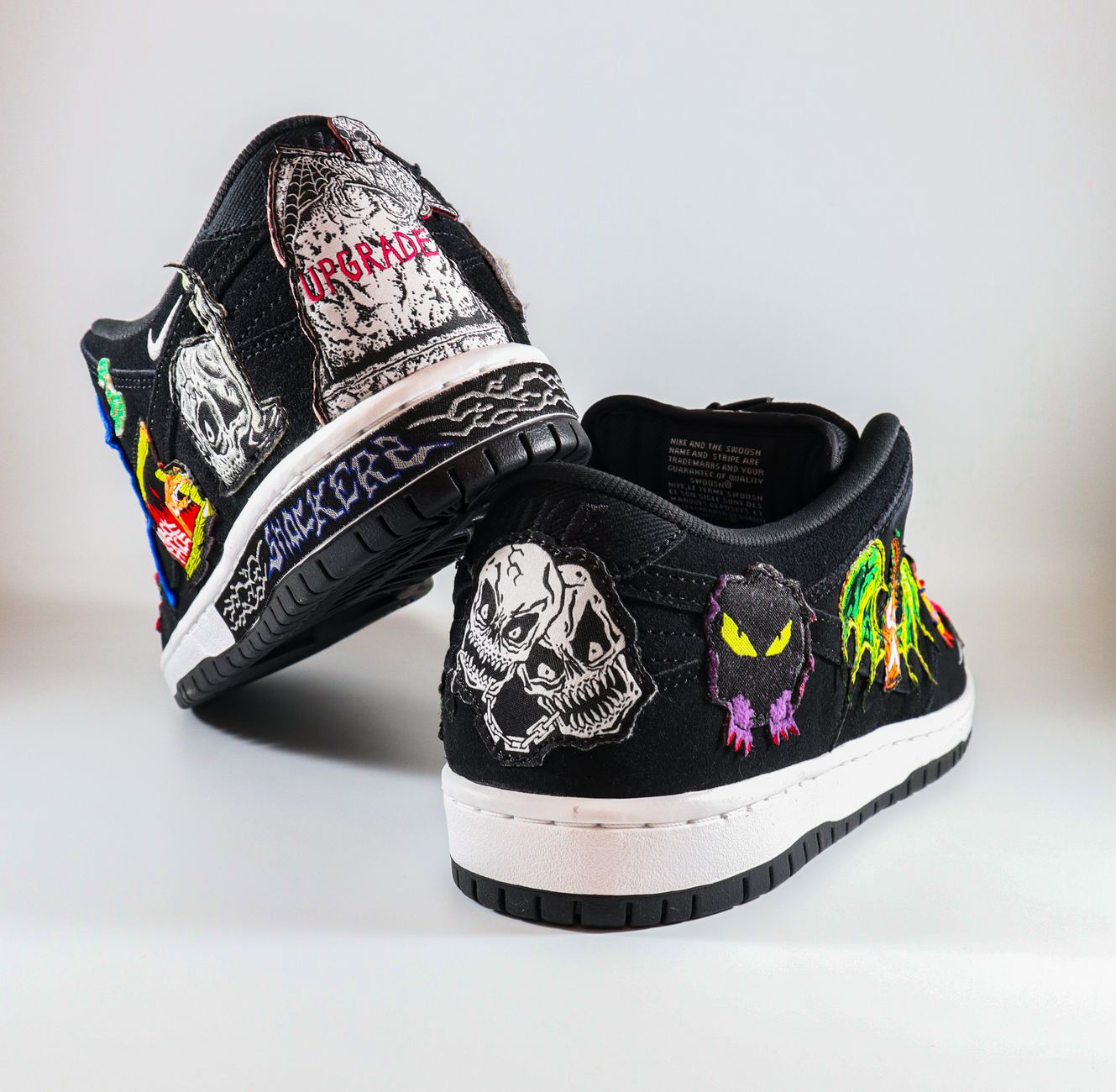 Unique custom sneakers featuring vibrant graphic art in a studio setting.