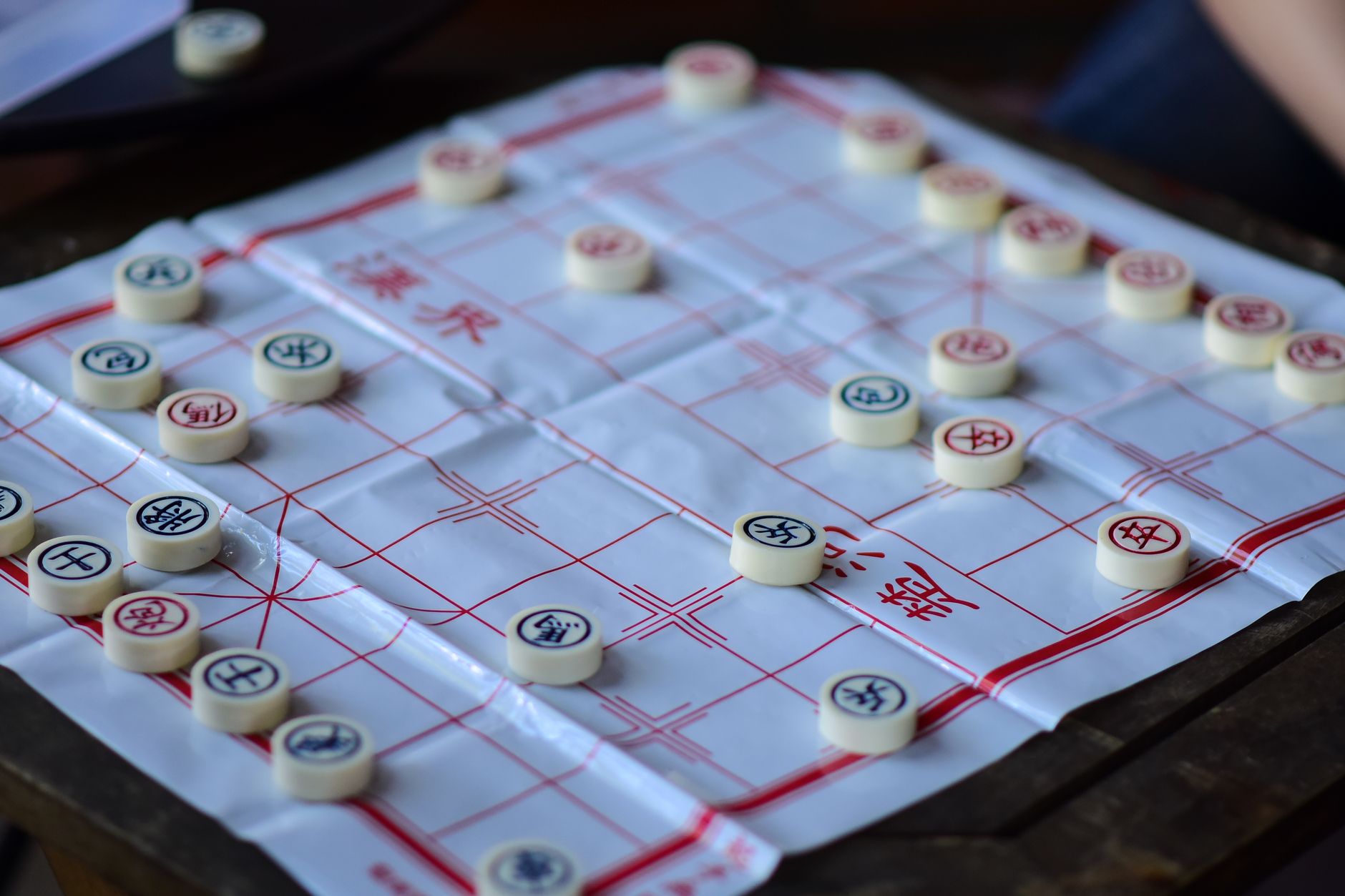 Close-up of a Chinese chess game, showcasing strategy and traditional culture.