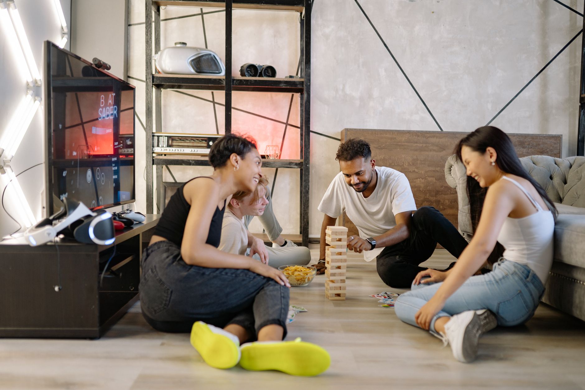 A group of diverse friends playing games and having fun indoors.