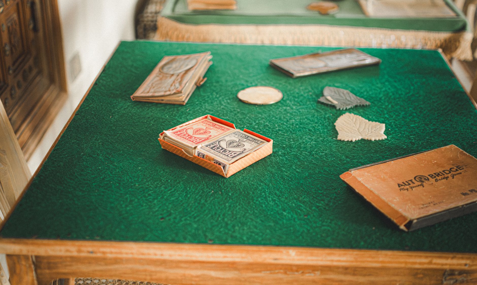 A vintage card game setup on a green felt table, evoking nostalgic play.